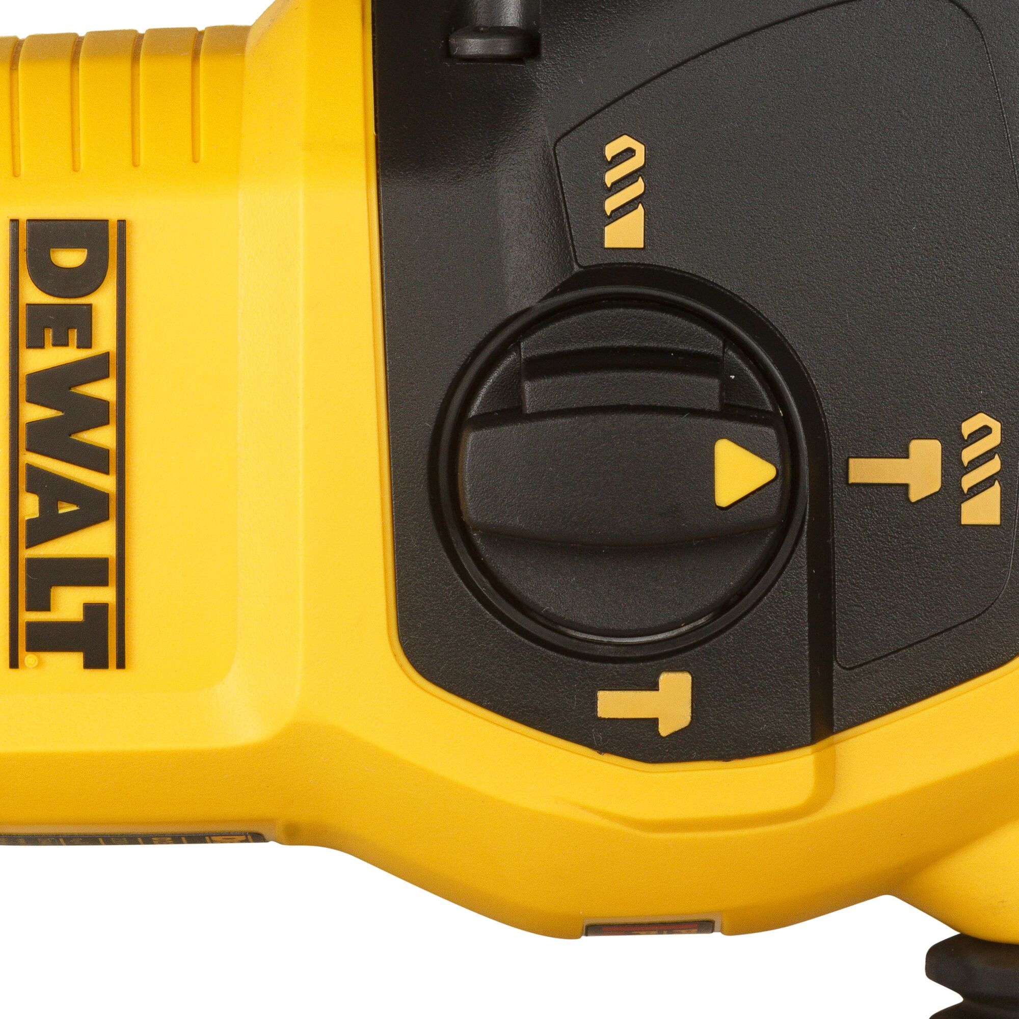 Close-up of a DEWALT power tool showing the brand logo and a black mode selection dial with yellow icons for different drilling options.