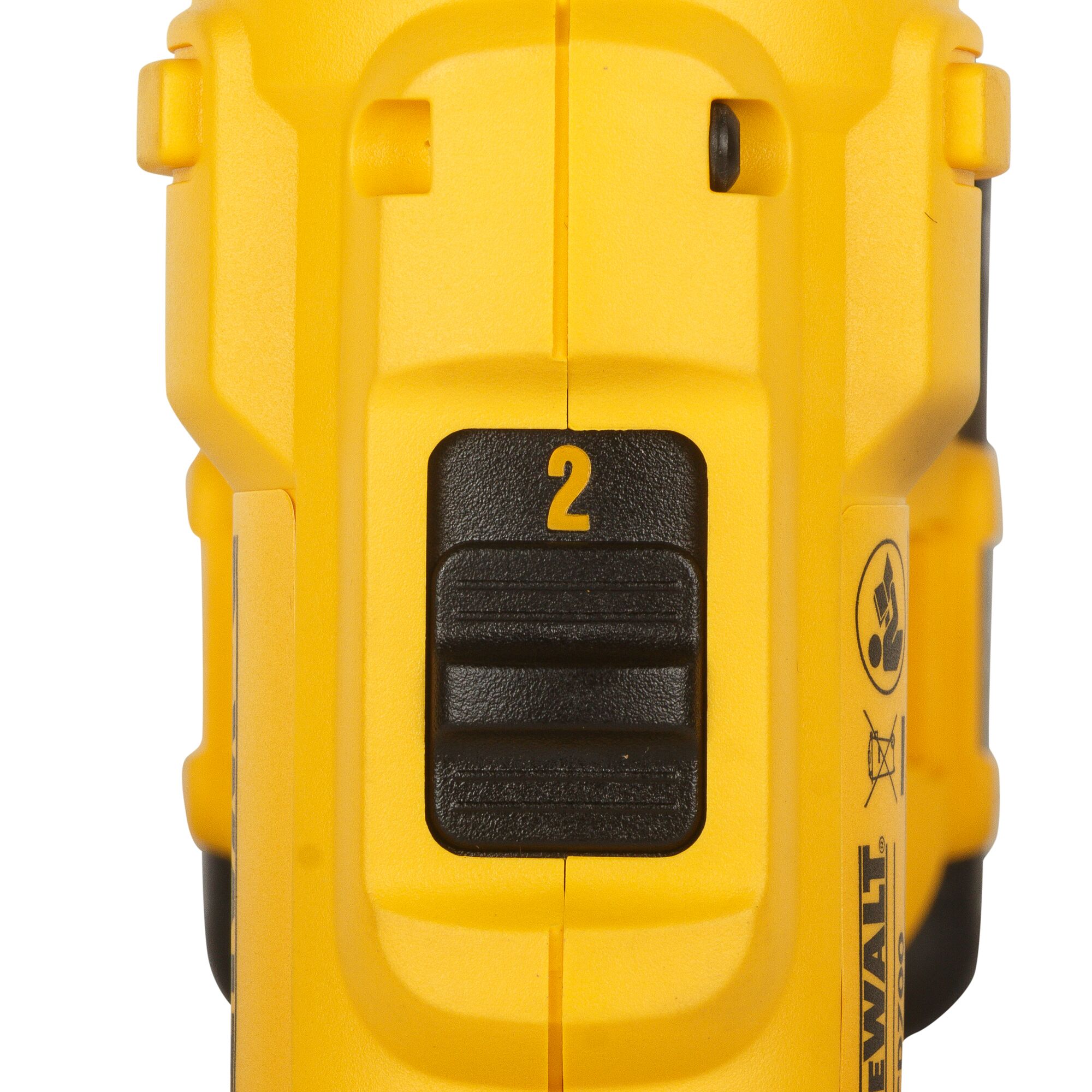 Close-up view of a yellow DEWALT power tool gearbox with a black speed selector switch set to position 2.