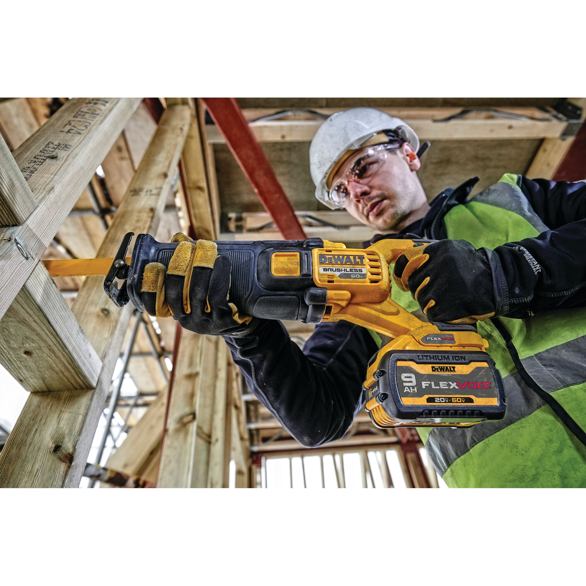 FLEXVOLT brushless cordless reciprocating saw being used by person on wood.