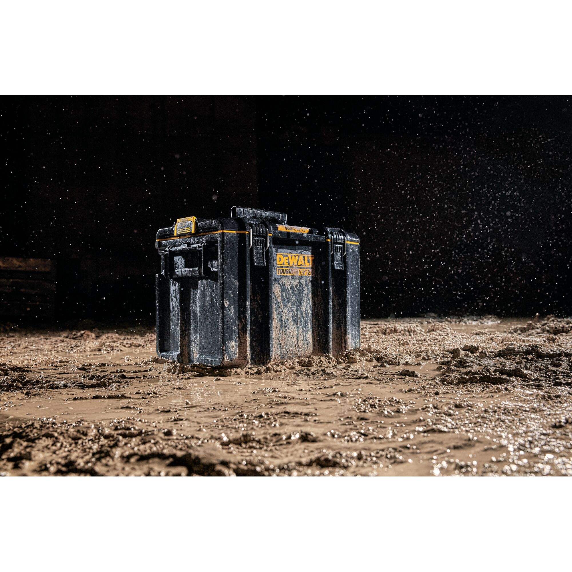 DEWALT DWST83342-1 tool box shown in muddy conditions with water splashing, highlighting durability.